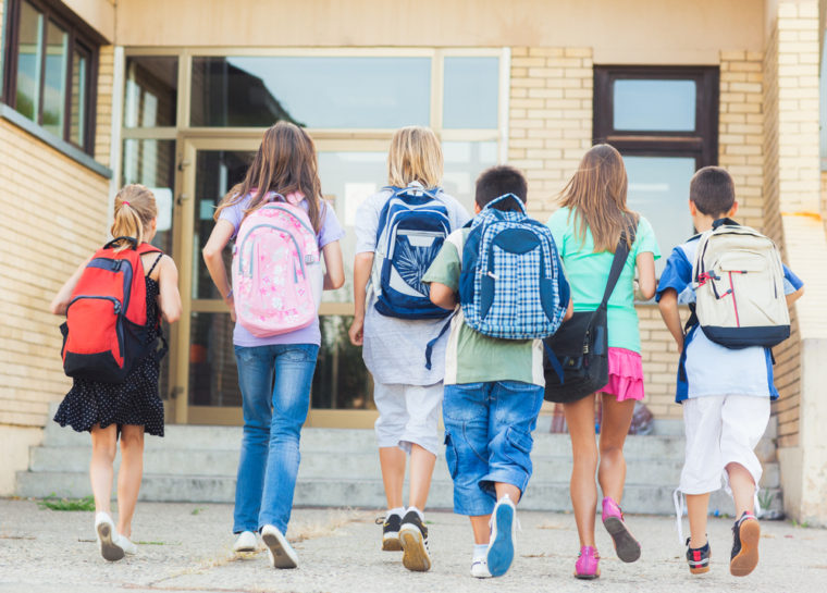 Group of kids going to school together.