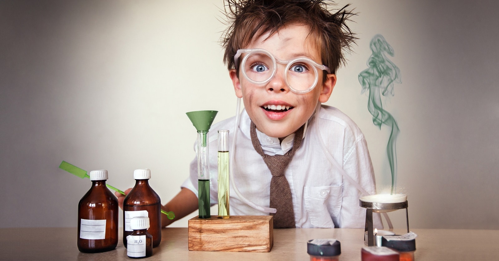 Crazy scientist. Young boy performing experiments