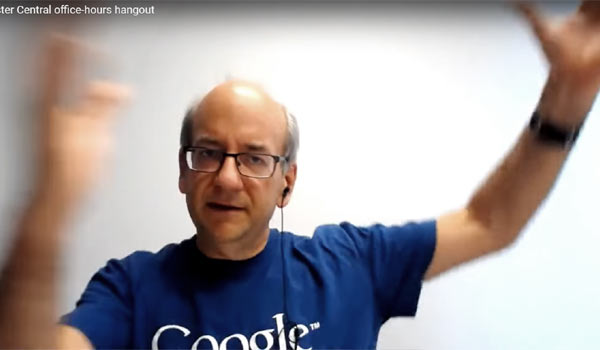 Google's John Mueller gesticulating as he answers question about Google's SERP feedback form.