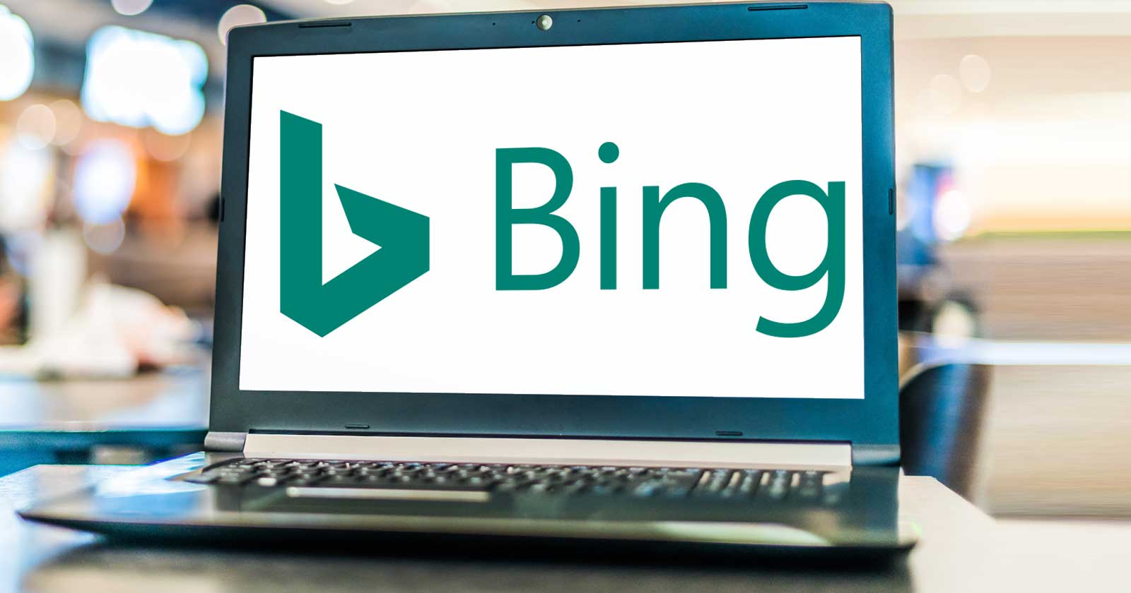 Image of a laptop with logo and name of the Bing search engine