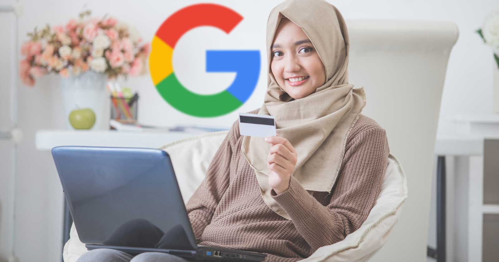 Image of an Indonesian Muslim woman shopping online and the Google logo behind her