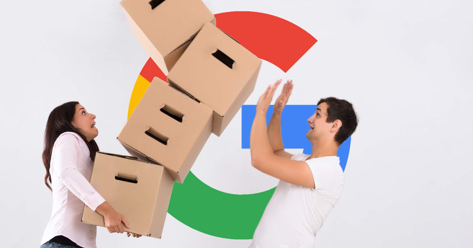 Google Logo behind a couple having trouble balancing boxes