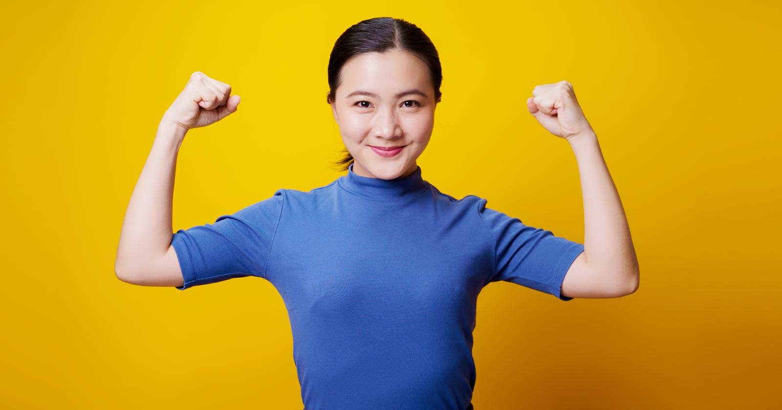 Image of woman flexing muscles as an illustration of an SEO gaining knowledge and power